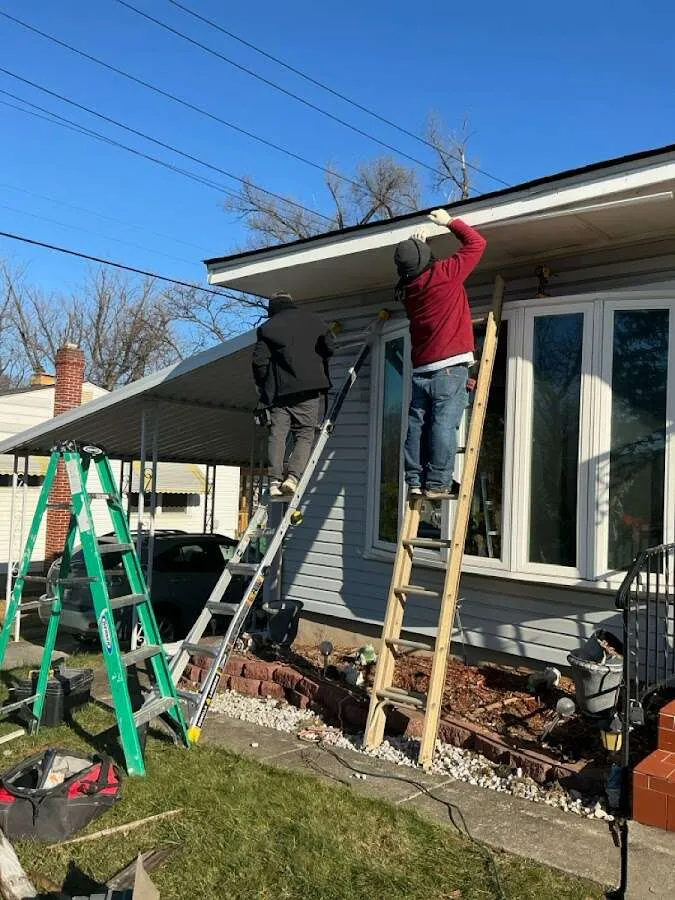 Restoration crew performing exterior repair in Schoolcraft